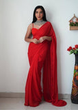 { "alt_text": "Red georgette solid saree with unstitched blouse, 5.5 meter ethnic wear, Indian fashion" }