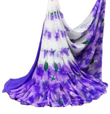 { "alt_text": "White-purple georgette saree with floral print, 5.5mtr ethnic wear, unstitched blouse for women" }