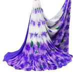 { "alt_text": "White-purple georgette saree with floral print, 5.5m women's ethnic wear, unstitched blouse" }