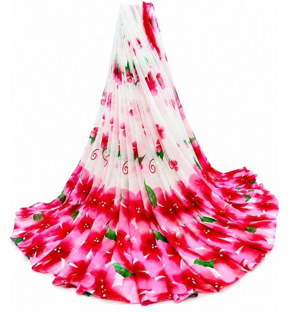 { "alt_text": "White-pink georgette saree floral printed women's ethnic wear, 5.5mtr unstitched blouse, Indian fashion" }