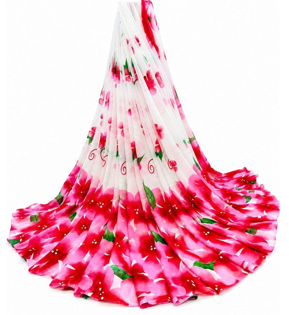 { "alt_text": "White-pink georgette saree floral printed women's ethnic wear, 5.5mtr unstitched blouse, Indian fashion" }