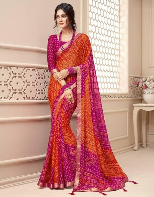 { "alt_text": "Orange-magenta georgette bandhani printed saree, 5.5m, ethnic wear, Indian wedding attire" }
