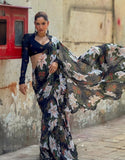 { "alt_text": "Black georgette saree with floral print, 5.5m women's ethnic wear, unstitched blouse for festive occasion" }