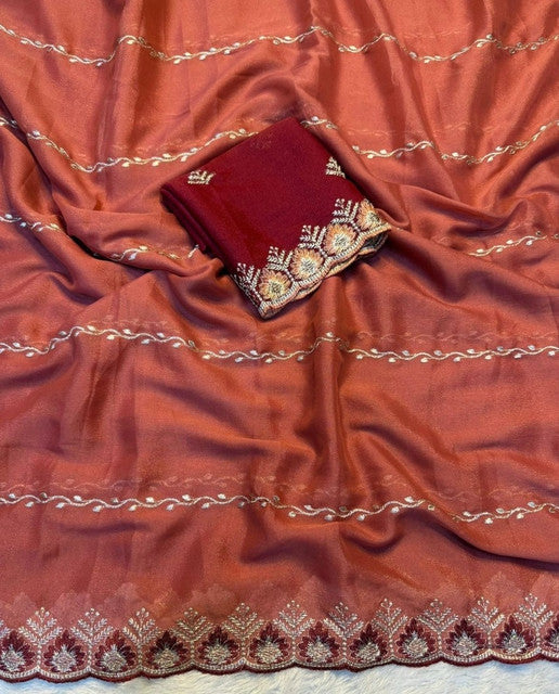 { "alt_text": "Rust orange georgette embroidered saree with unstitched blouse, 5.5 meter ethnic wear, Indian fashion" }