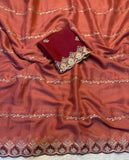 { "alt_text": "Rust orange georgette embroidered saree with unstitched blouse, 5.5 meter ethnic wear, Indian fashion" }
