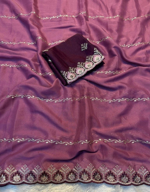 { "alt_text": "Pink georgette embroidered saree with unstitched blouse, 5.5 meter ethnic wear, Indian occasion outfit" }