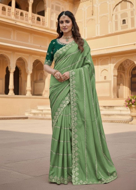 { "alt_text": "Pista Green georgette embroidered saree with unstitched blouse, 5.5Mtr ethnic wear, Indian fashion" }