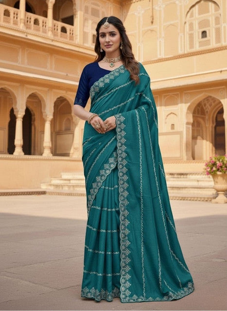 { "alt_text": "Teal georgette embroidered saree with unstitched blouse, 5.5m, ethnic wear fashion" }