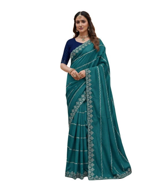 { "alt_text": "Teal georgette embroidered saree with unstitched blouse, 5.5 meter ethnic wear, Indian fashion" }