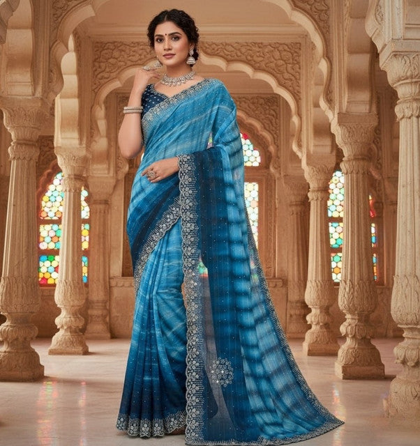 { "alt_text": "Blue georgette saree with unstitched blouse, striped ethnic wear, 5.5 meter georgette fabric" }