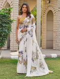 { "alt_text": "Off white georgette saree with floral butterfly print, 5.5m georgette ethnic wear for women" }