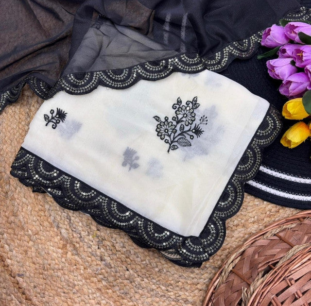 { "alt_text": "White-black georgette embroidered saree with unstitched blouse, 5.5m, ethnic wear fashion" }