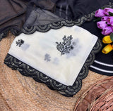 { "alt_text": "White-black georgette embroidered saree with unstitched blouse, 5.5m, ethnic wear fashion" }