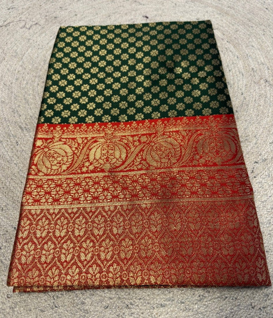 { "alt_text": "Dark green jacquard printed saree with unstitched blouse, 5.5m, ethnic wear, Indian traditional clothing" }
