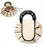 Beige and black polyester makeup organizer bag with large drawstring opening for travel and daily essentials