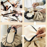 Beige and black polyester makeup organizer bag with large drawstring opening for travel and daily essentials