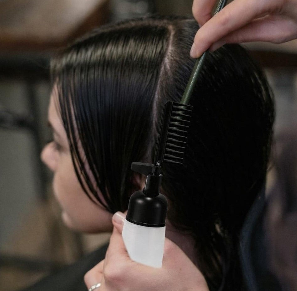 Black plastic 2-in-1 root comb and applicator bottle for even hair dye and scalp treatment application