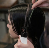 Black plastic 2-in-1 root comb and applicator bottle for even hair dye and scalp treatment application