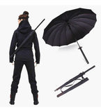 Black metal and plastic katana umbrella designed as a samurai sword for rain protection