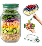 Green plastic layered salad container with airtight lid and built-in dressing cup for meal prep