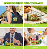 Green plastic layered salad container with airtight lid and built-in dressing cup for meal prep