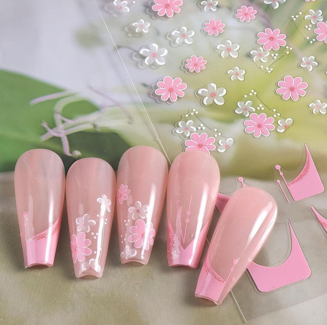 Multicolor self-adhesive nail art stickers featuring floral, daisy, and decorative designs for DIY nail decoration