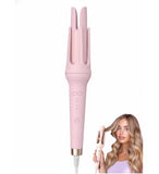 Pink plastic and stainless steel automatic hair curler with adjustable temperature settings for easy styling