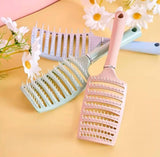 Multicolor plastic detangling hair brush with vented design for wet or dry hair grooming