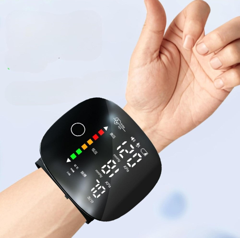 Black plastic digital blood pressure monitor for home use with adjustable wrist cuff and clear digital display