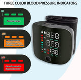 Black plastic digital blood pressure monitor for home use with adjustable wrist cuff and clear digital display