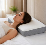 White-grey orthopedic memory foam pillow providing therapeutic support for neck and shoulder alignment