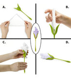 Green plastic napkin holder set designed to display folded paper or cloth napkins in a flower arrangement style