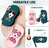 Multicolor silicone glasses case with cute cartoon face design, wrist strap, and microfiber cloth included