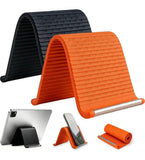 Orange and black silicone phone holder with adjustable aluminum support for universal smartphone and tablet compatibility