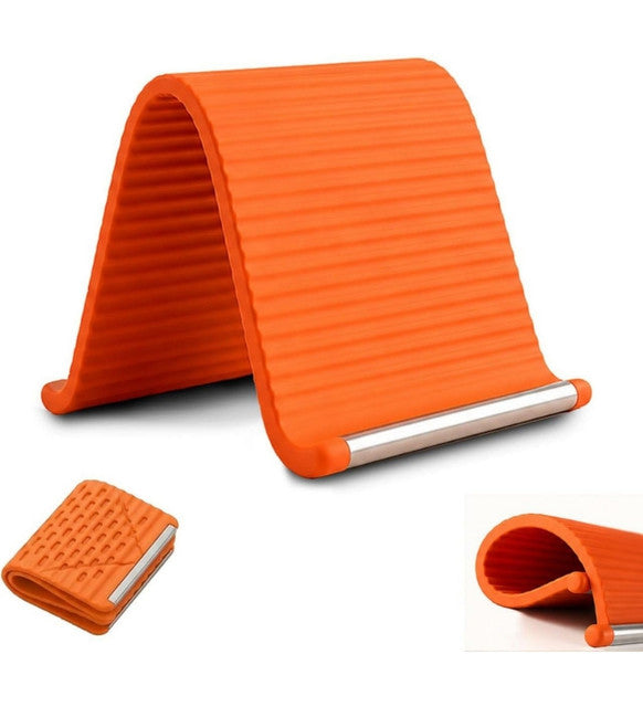 Orange and black silicone phone holder with adjustable aluminum support for universal smartphone and tablet compatibility