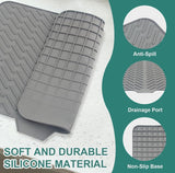 Grey silicone dish drying mat with built-in drain spout, non-slip, and heat resistant for kitchen use