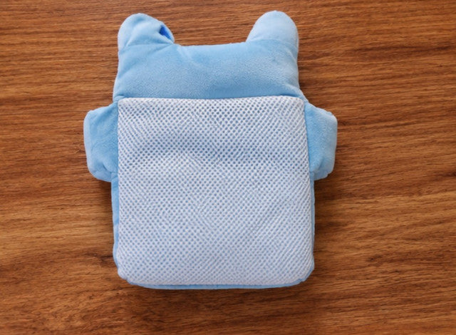 Blue cotton baby neck pillow providing soft support for newborns and infants during sleep and travel