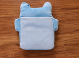 Blue cotton baby neck pillow providing soft support for newborns and infants during sleep and travel