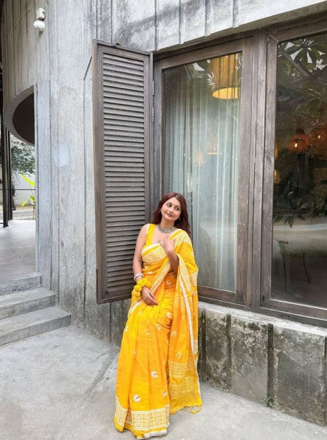 Yellow linen floral printed saree with unstitched blouse piece, 5.5 meters length