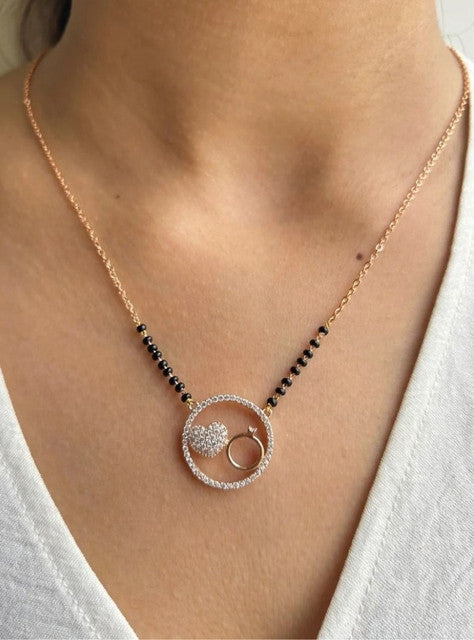 Multicolor brass gold plated mangalsutra pendant necklace featuring a heart and ring design on a black beaded chain