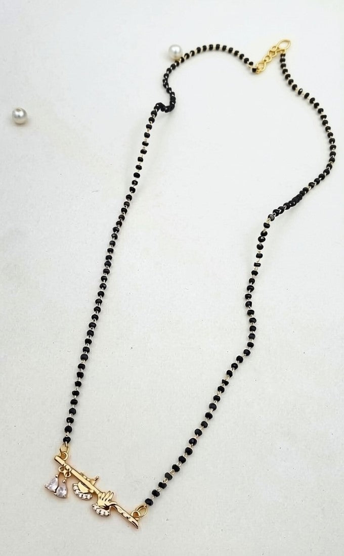 Multicolor brass gold plated mangalsutra pendant featuring Krishna flute and peacock design on a black beaded chain
