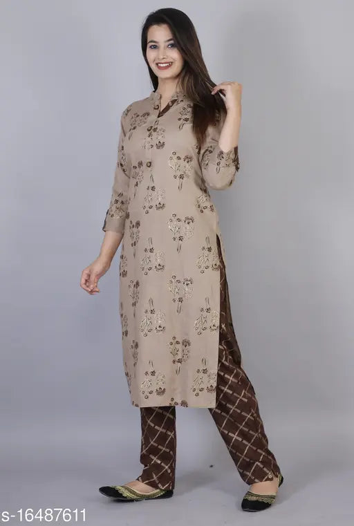 Women's printed brown rayon kurta pant set with three-quarter sleeves, single piece, featuring a detailed print design on both garments. Indian handcrafted traditional ethnic wear