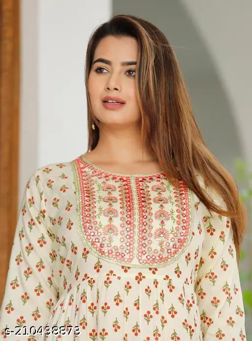 Cream rayon printed gown with three-quarter sleeves, Indian embroidery detail on display. [M:38in], [L:40in], [XL:42in], [XXL, 4XL] available