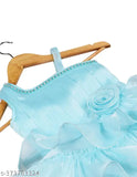 This is a blue dress with a white lace trim and a ruffled detail at the hem. It features a sweetheart neckline, long sleeves, and decorative buttons. The dress has a floral print on the bodice and appears to be for a young girl or baby girl, based on its style and size