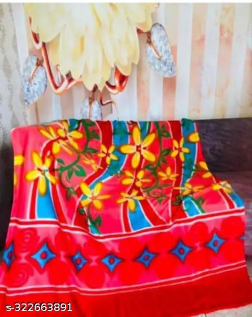 Multi-colored, embroidered blanket with intricate patterns