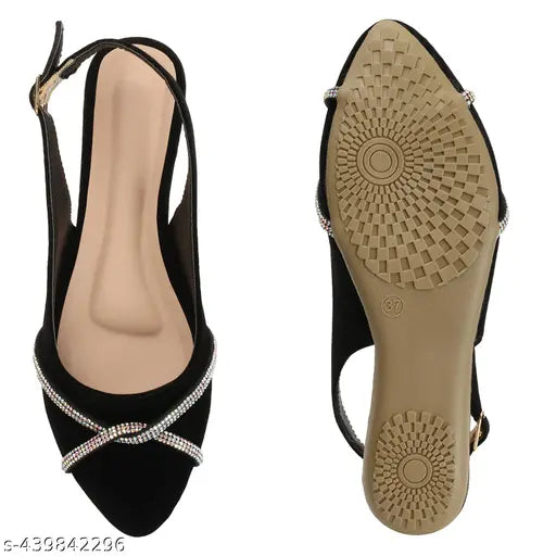 Women's flat, bell-shaped footwear in black with decorative buckles