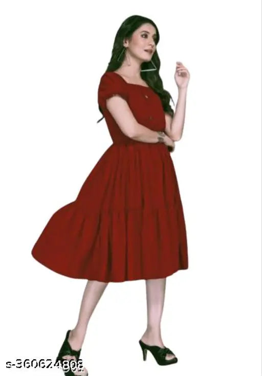 Red sleeveless dress with pleated skirt