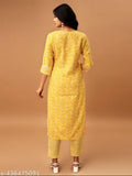 White cotton blend printed kurta set with blue pants, V-neck floral design on Indian woman