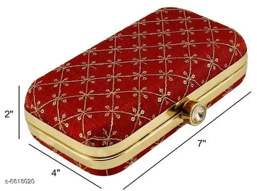 Red velvet womens clutch with gold accents and a hinged lid