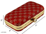 Red velvet womens clutch with gold accents and a hinged lid